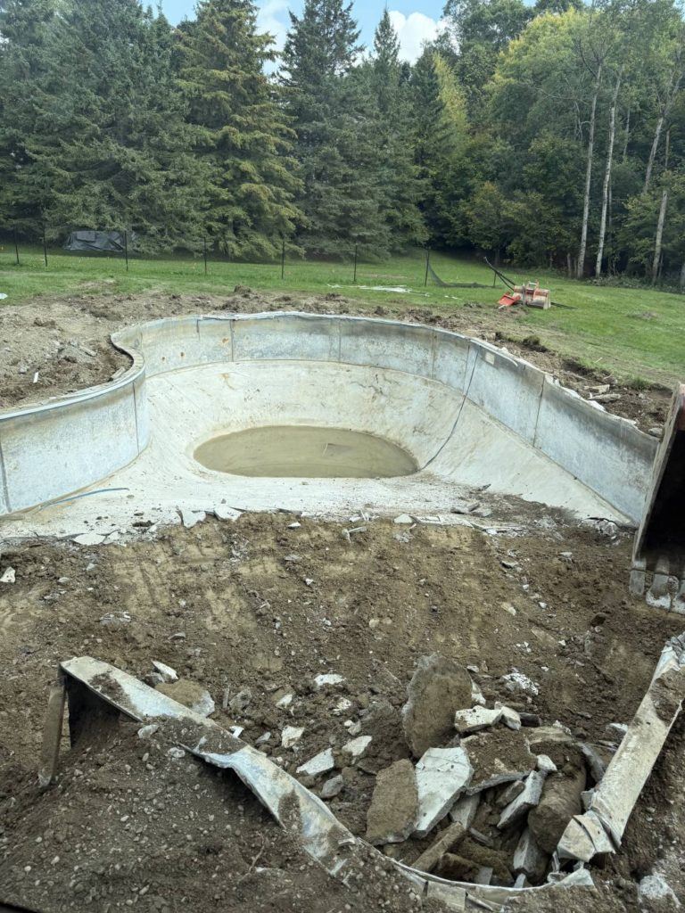 a partially destroyed concrete swimming pool