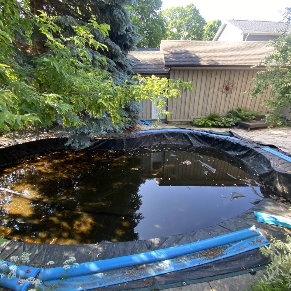 a pool filled with dirty water