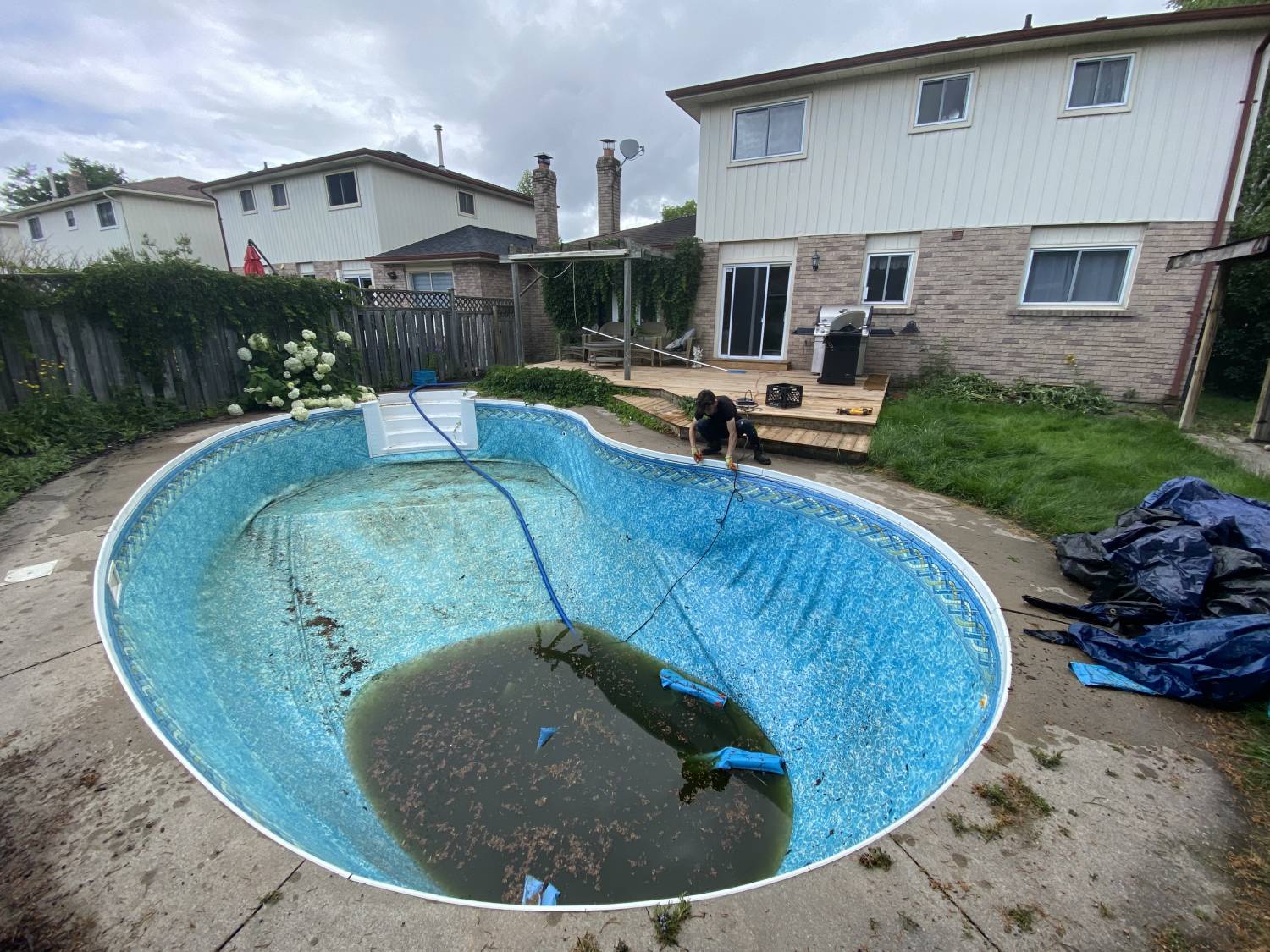 water being pumped out of a swimming pool