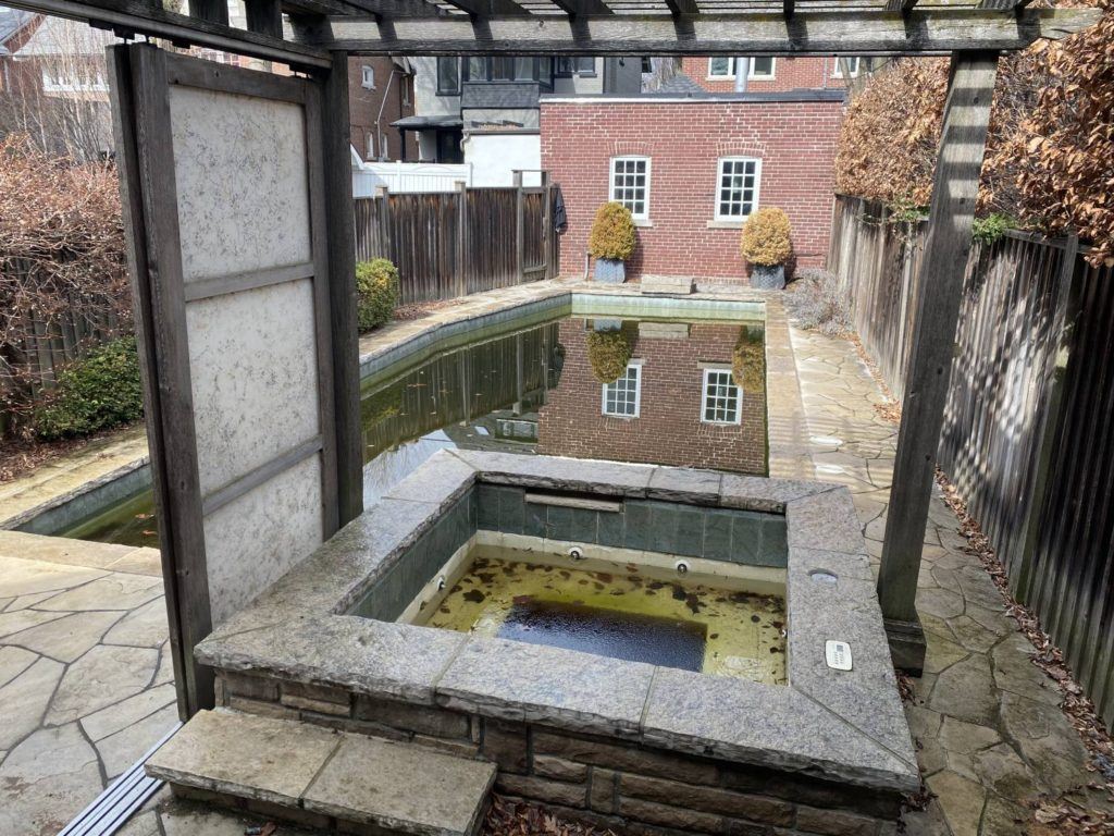 a swimming pool reflecting its surroundings