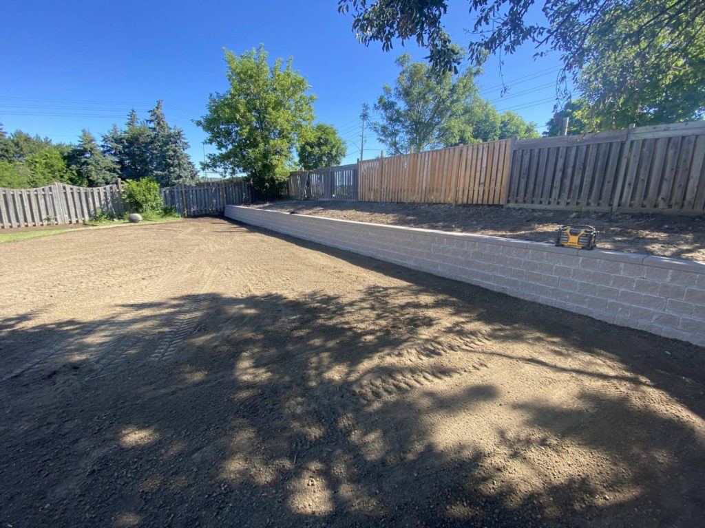 a large expanse of sand in a garden